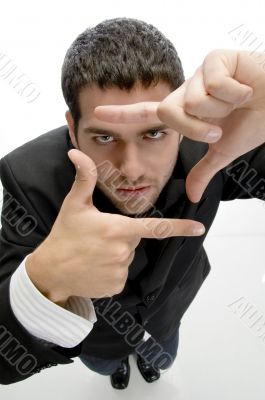 businessman making frame with fingers