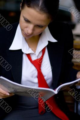 businesswoman reading magazine