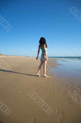 back dressed woman at the beach