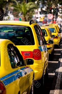 Parked Yellow Taxi Cab Waiting for a Fare