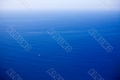 Small boat in great ocean