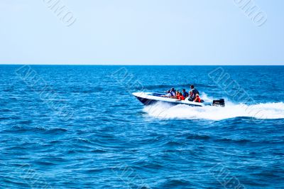 Speed boat at full speed on the high seas.