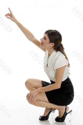 sitting lady pointing upside