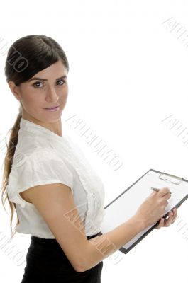 smiling lady writing on paper
