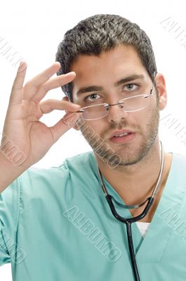 doctor holding spectacles