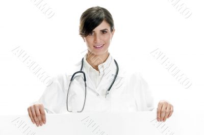 lady doctor standing with placard