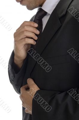 adult man fastening tie