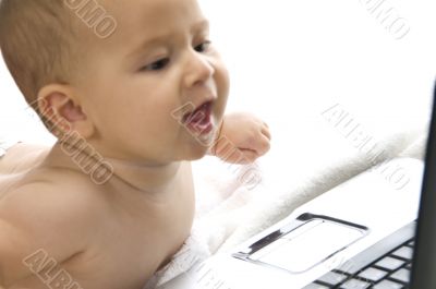 lovely curious child with laptop