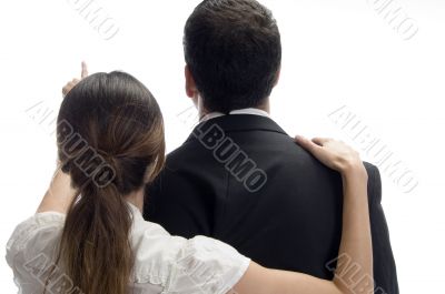 woman pointing towards and posing from back