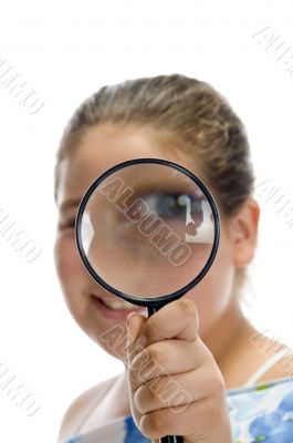 girl looking through magnifier
