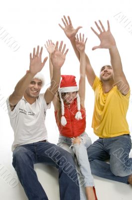 young friends with raised hands