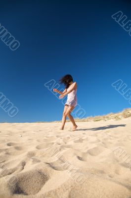 woman dancing on the sand