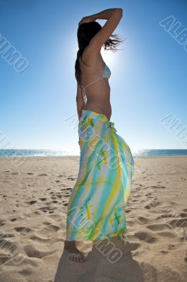 woman dancing with beach wrap