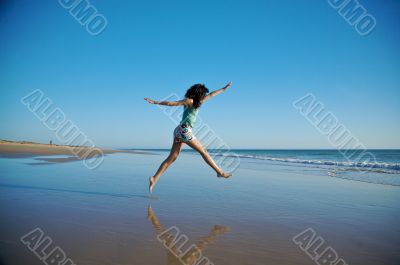 woman jumping at seaside