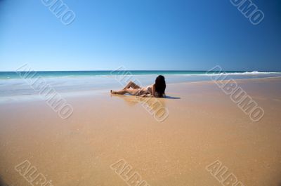 woman lie down at seaside