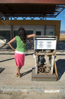 woman and old gas pump