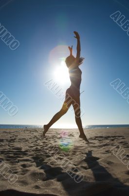 woman jumps against the sun