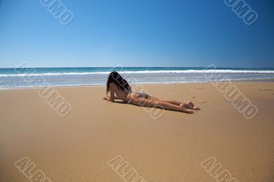 bikini woman lie down on the sand