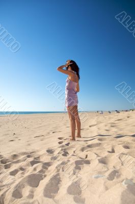 touching hair at the beach