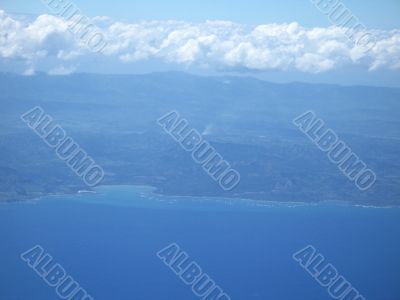 ocean and land viewed from a plane