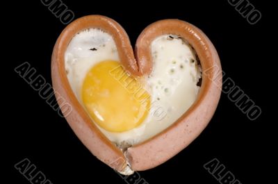 eggs and sausage on black