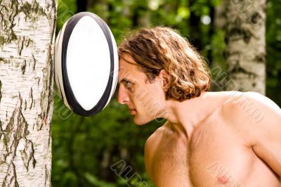 Caucasian strong man playing rugby ball outdoors