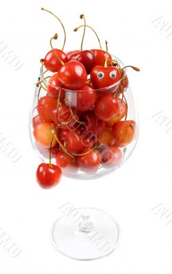 The glass filled by a sweet cherry