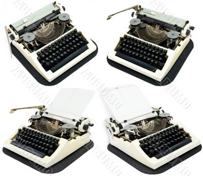 Ancient typewriters on a white