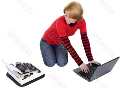 Girl with the laptop and a typewriter