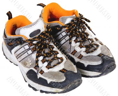 The old sports boots on a white