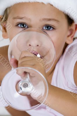 little girl holding glass