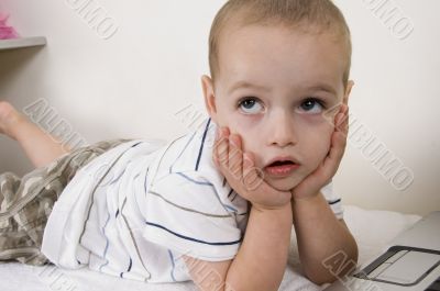 child in thinking pose