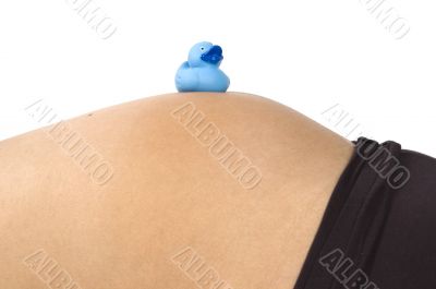 30 weeks pregnant teenager with blue duck on her belly