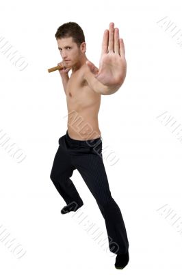 young person holding nunchaku warning to stop