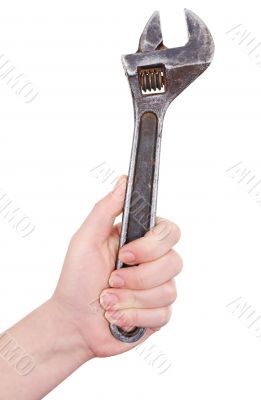Big wrench in a hand