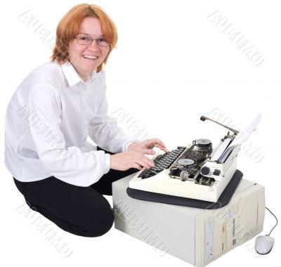 Girl printing on an typewriter