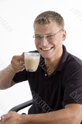 pleased man taking tea