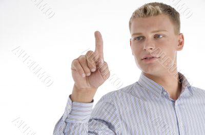 young male pointing upward