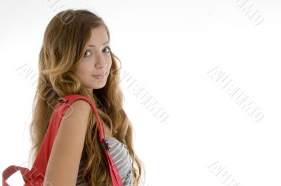 beautiful girl with bookbag on her shoulder