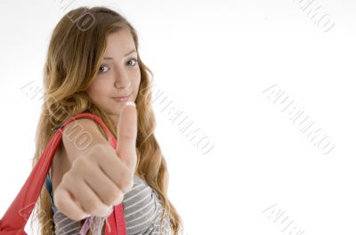 beautiful girl showing thumbs up hand gesture