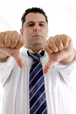 serious businessman showing thumb down gesture