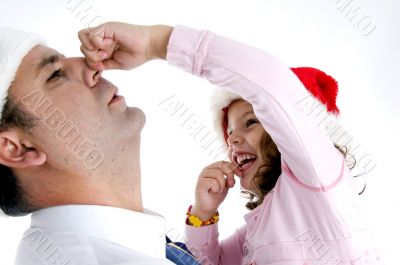 girl holding her father`s nose