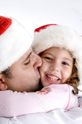 father kissing his little daughter