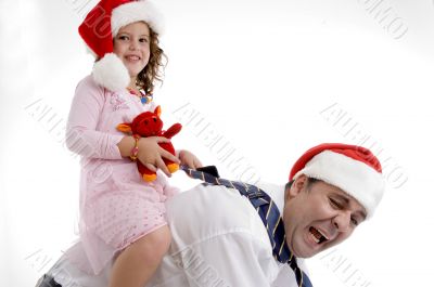 smiling little girl sitting on her father`s back