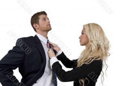 lady knotting tie of man