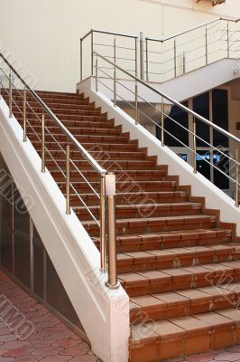 Stone ladder with a metal handrail
