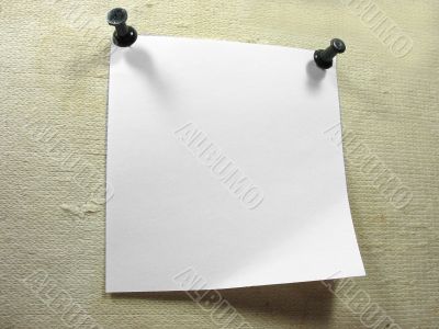 White piece of notice paper over a old canvas background