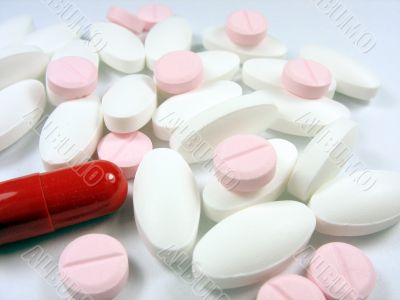 close up of pharmaceutical different color medical drugs