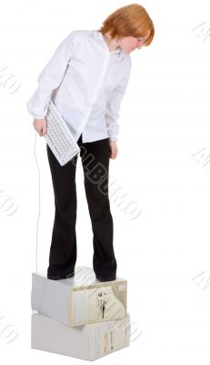 Girl standing on two computers