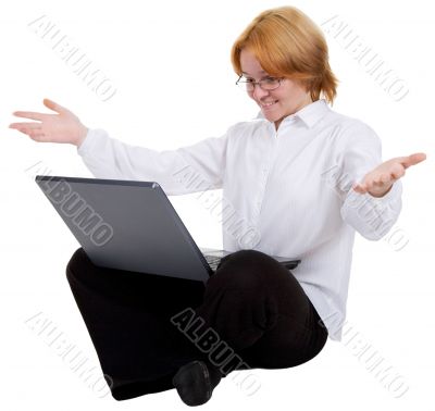 Woman sitting on a floor with the notebook